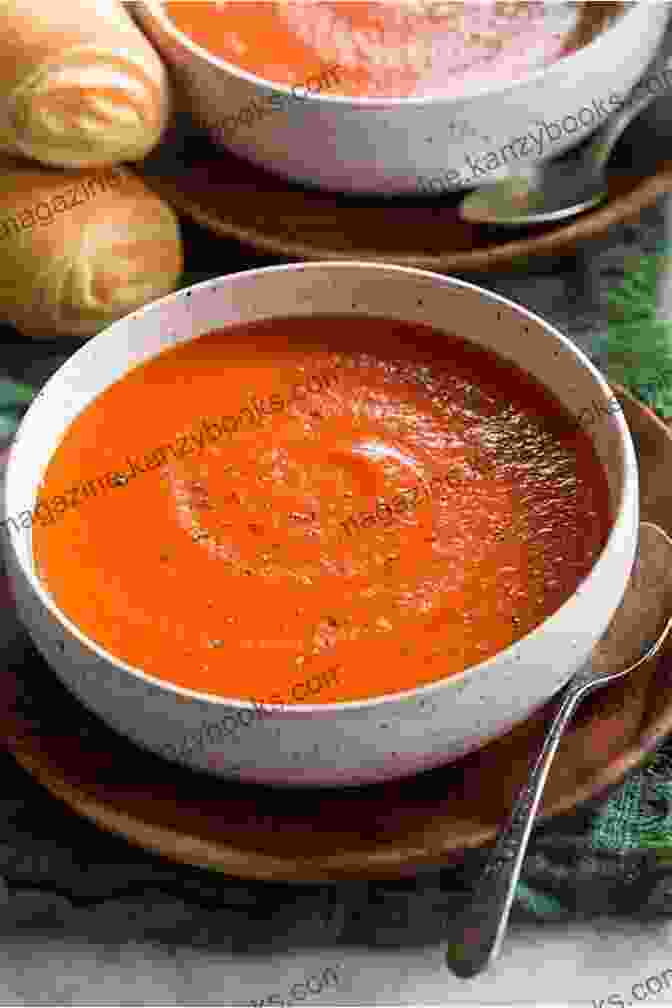 A Creamy Bowl Of Tomato Soup With Fresh Basil Soup Makes The Meal: 150 Soul Satisfying Recipes For Soups Salads And Breads: 150 Soul Satisfying Recipes For Soup Salads And Breads