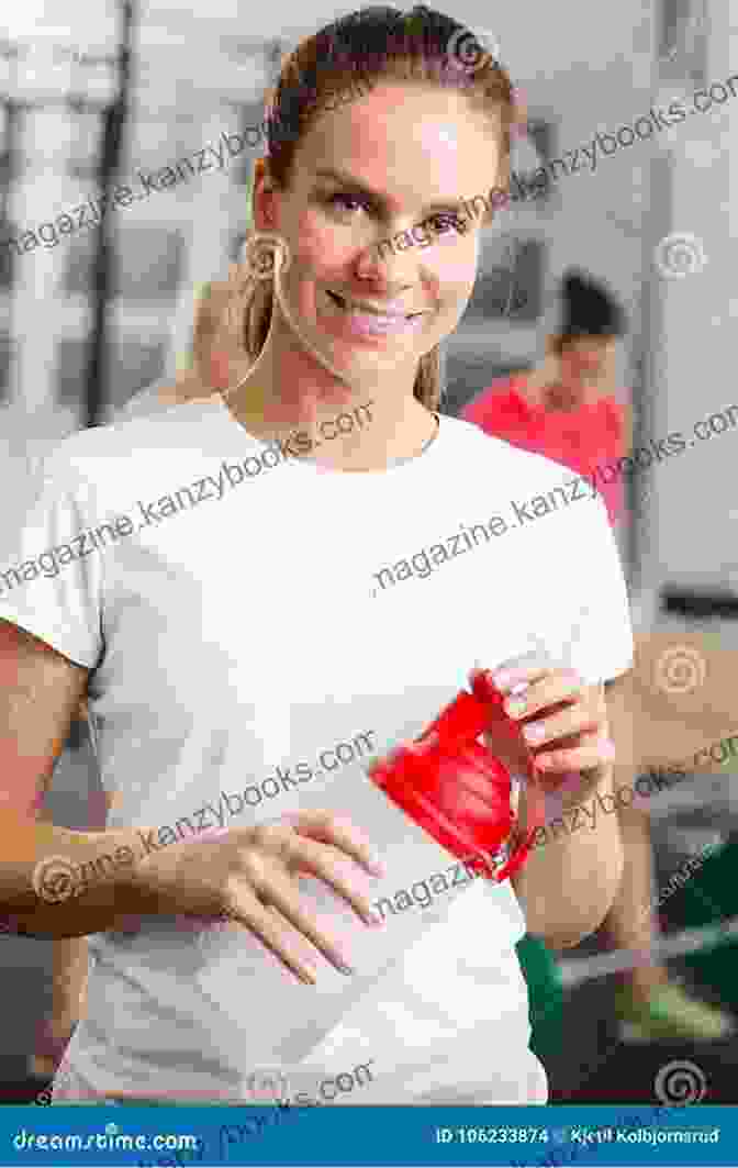 A Smiling Person In A Fitness Outfit, Holding A Copy Of The Book 'Stretch, Strengthen, Live, And Thrive.' The Athlete In The Game Of Life: Stretch Strengthen Live And Thrive