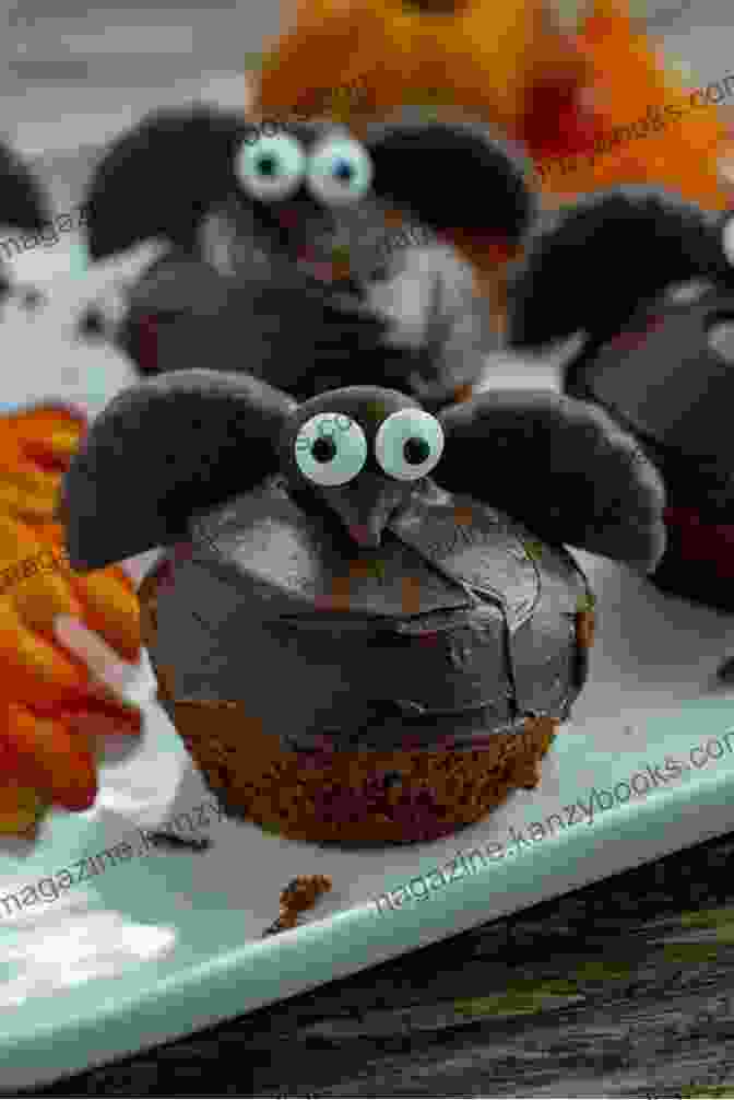 Bat Cupcakes With Black Frosting And Candy Corn Wings Ghoulish Goodies: Creature Feature Cupcakes Monster Eyeballs Bat Wings Funny Bones Witches Knuckles And Much More