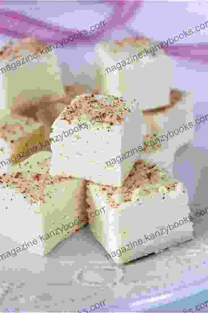 Homemade Eggnog Fudge, Cut Into Squares And Arranged On A Plate, Boasting A Creamy Texture And Festive Eggnog Flavor Sweet Christmas: Homemade Peppermints Sugar Cake Chocolate Almond Toffee Eggnog Fudge And Other Sweet Treats And