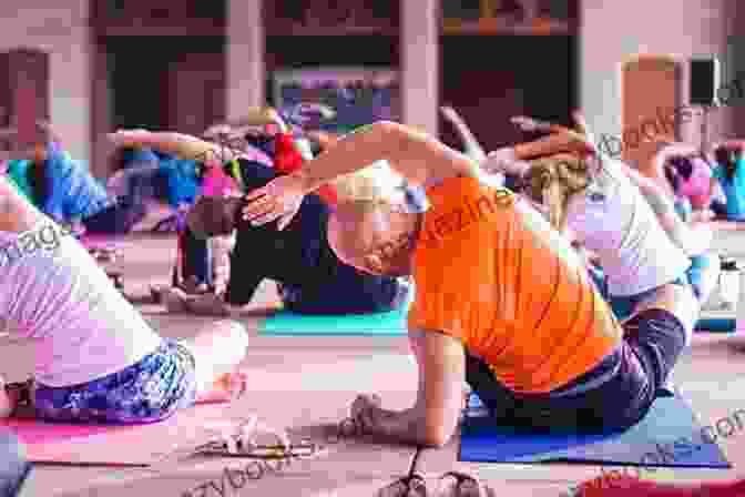 Image Of A Person Teaching Yoga To A Group, Empowering Others To Discover The Benefits Of Yoga Therapy Yoga Therapy Foundations Tools And Practice: A Comprehensive Textbook